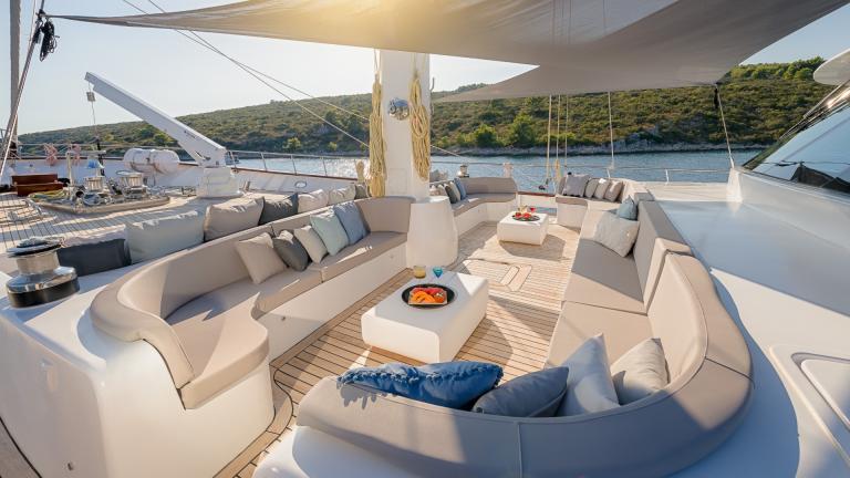 On the main deck, a cosy lounge covered with awnings also offers shaded seating.
